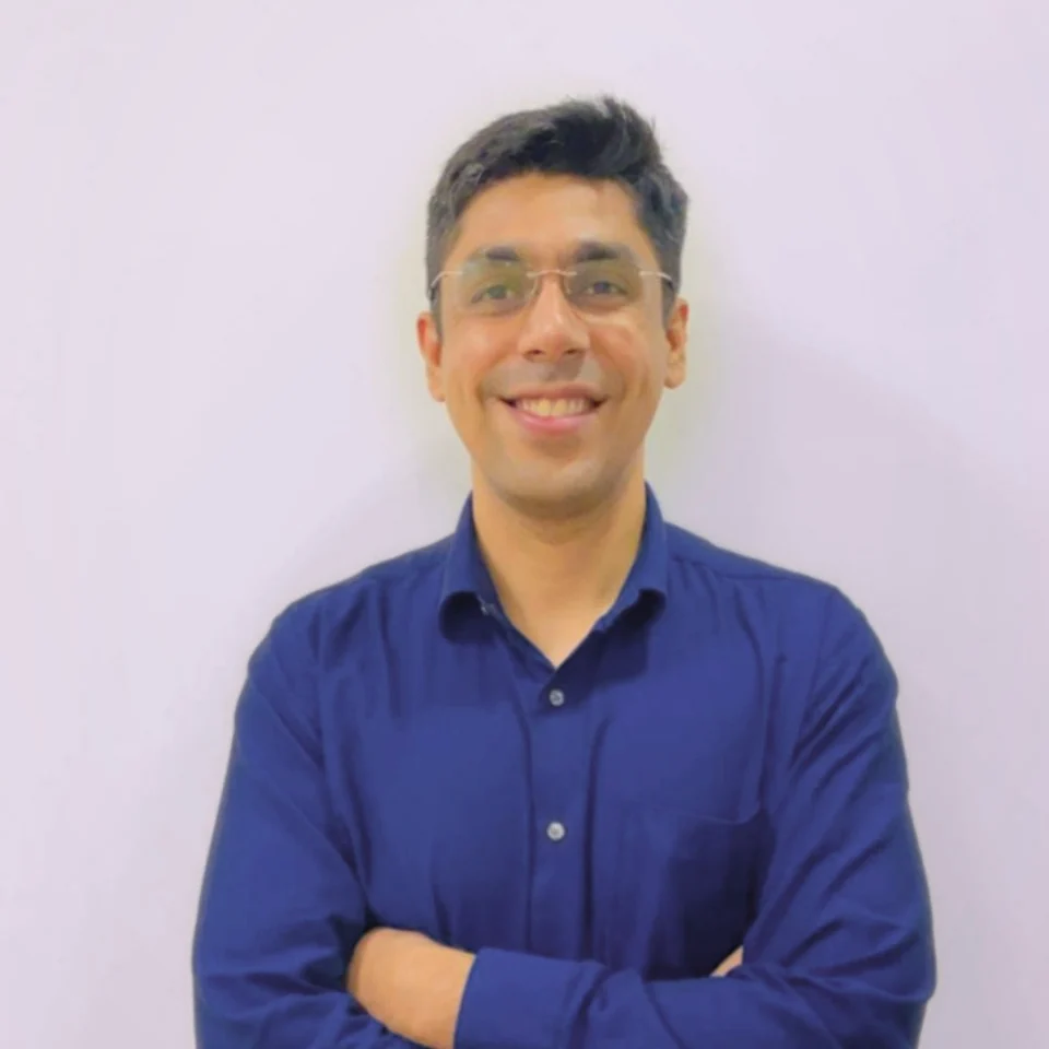 Dr. Jatin Tarwani, Addiction Psychiatrist, smiling in a navy shirt
